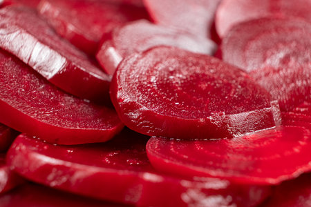 Texture of boiled red beetroot cut into slices.