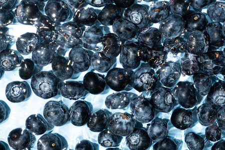Top View of Blueberries Splashing in Water.の写真素材