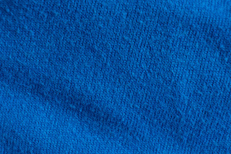 Close-Up of Aged Cotton Textile with Blue Pattern.