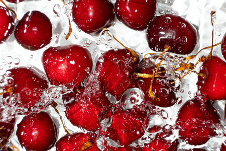 Red Sweet Cherries with Water Splash from Above.の写真素材