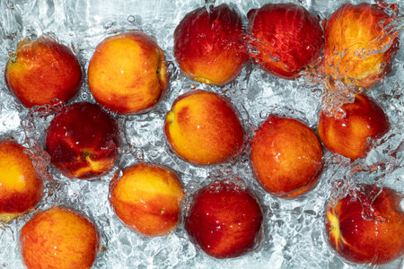 Fresh Peaches in Water. Top View Composition with Water Movement.の写真素材