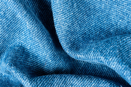 Macro View of Wrinkled Denim Cloth with Shadows and Texture
