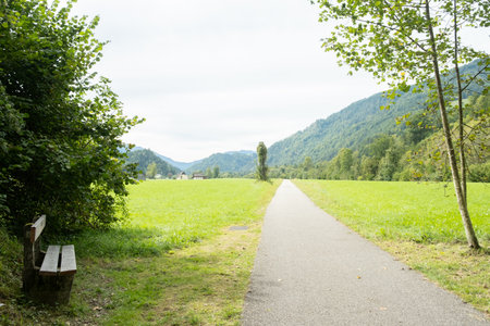 A trail in the mountains and a bench for outdoor recreation.の写真素材