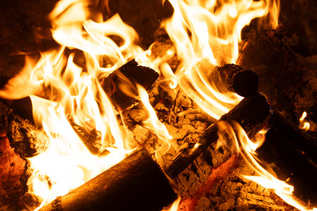 Horizontal Background of Firewood Heating up with Bright Flames.の写真素材