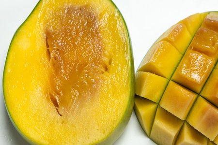 Close-up of overripe mango fruit with soft texture and dark spots