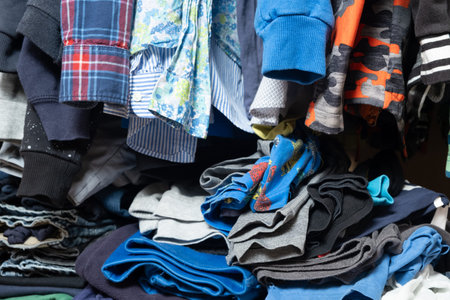 Space organization in the wardrobe, real view inside the wardrobe with clothes.の写真素材