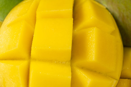 Juicy mango halves with cube cut pattern