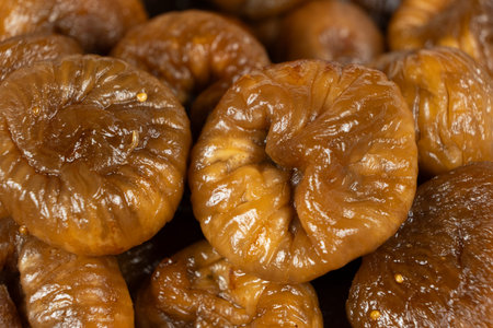 Pile of sweet organic sun-dried figs, macro top view