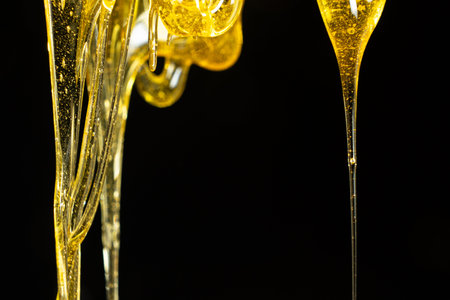 Creative honey swirl on black background