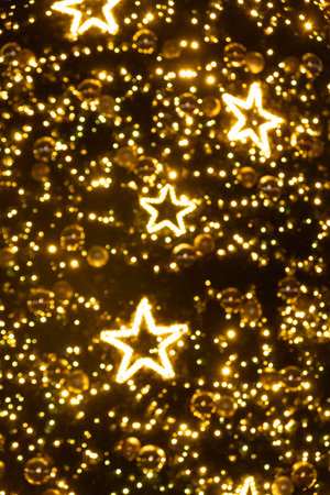 Abstract Christmas Background with Blurred Golden Bokeh Lights