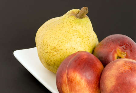Pear and Nectarines on plain background, Studio shot.の写真素材