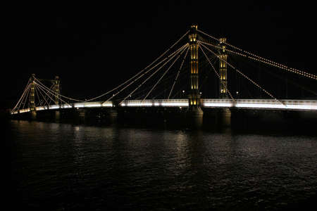 A view of The Albert Bridge at night in London.の写真素材