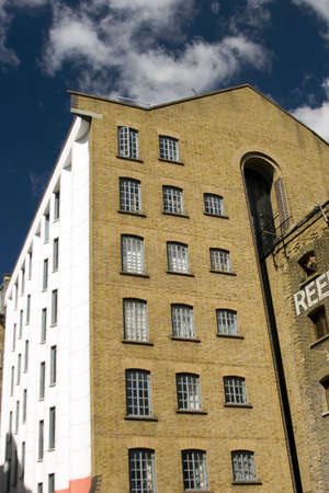 Modern converted warehouse along the river Thames, London.