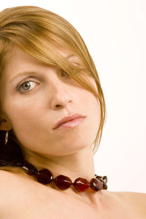 A portrait of a young woman against a plain background.の写真素材