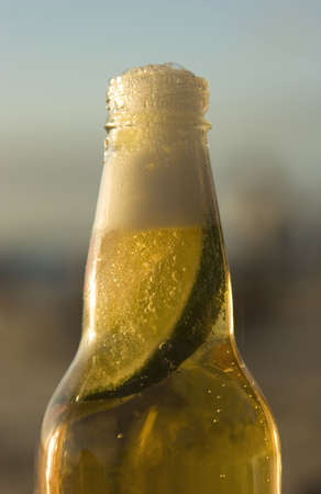 A mexican bottle of beer with a slice of lime.の写真素材