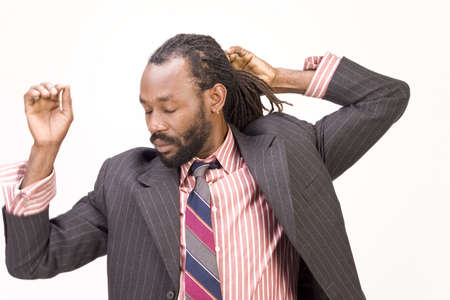 A black man with dreadlock hair isolated on a white background.の写真素材