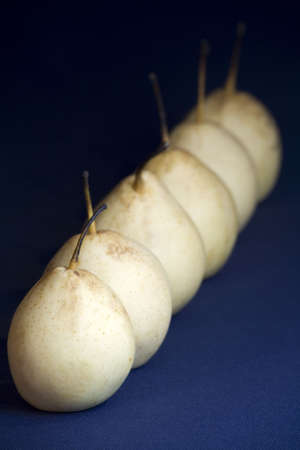 Six Asian pear fruit on a linen blue background.の写真素材