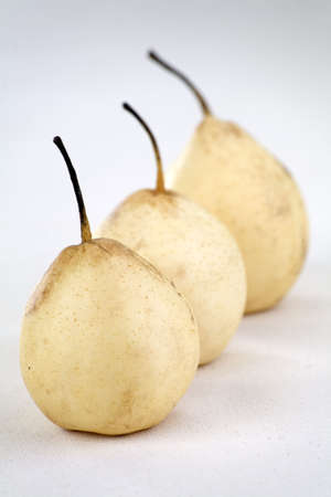 Three Asian pear fruit on a linen background.の写真素材