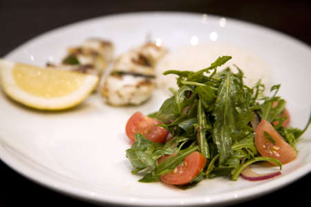 A Mixed Salad with a lemon wedge.の写真素材