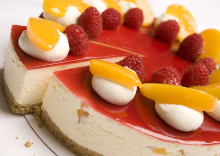 A portion of Raspberry & Mandarin cheesecakeの写真素材