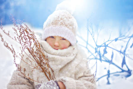 Girl in white clothes in winterの写真素材