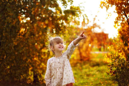 Girl shows a finger upの写真素材