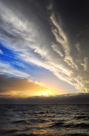 layers of clouds threatening on the horizon at sunset is approaching  Sicily is hidden の写真素材