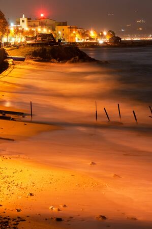 part of the beach Cannitello  Reggio Calabria  in the evening, during a storm  Messina background 