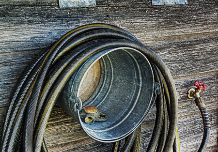 DIY bucket hose hanger. Grunge style.の写真素材
