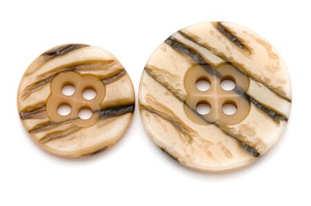 object on white sewing tool dress button