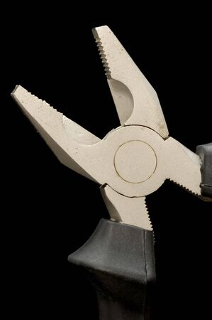 object on black - tool combination pliers