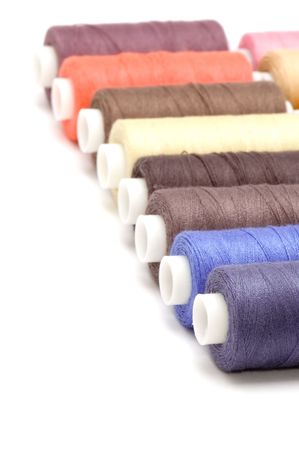 object on white - sewing cotton rolls