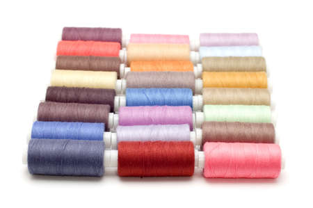 object on white - sewing cotton rolls