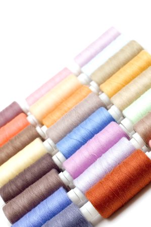 object on white - sewing cotton rolls 