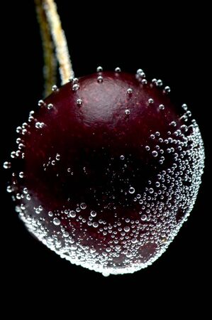 object on black - food cherries in waterの写真素材