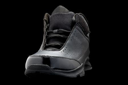 object on black - Sport shoes isolated on the blackの写真素材