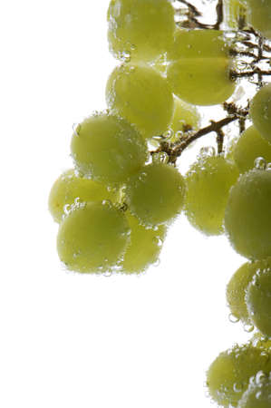 object on white - Green grapes in water