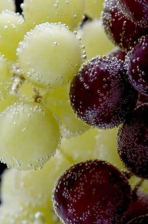 object on black - grapes in water