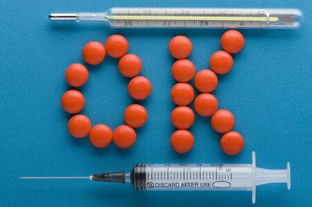 object on blue - medical Tablet and thermometerの写真素材