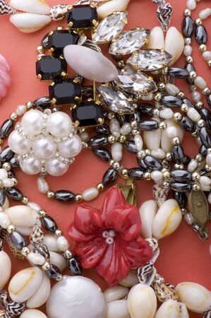 object on red - costume jewel close upの写真素材