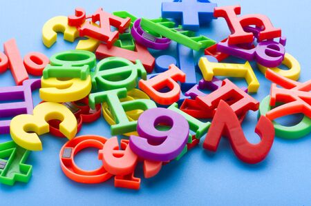 object on blue - toy plastic letters and numbers