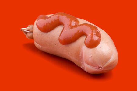 object on red - food sausage with ketchup and mustardの写真素材