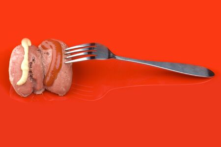 object on red - food sausage with ketchup and mustardの写真素材