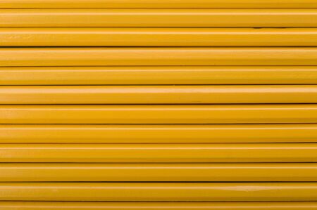 background from yellow crayon close up の写真素材