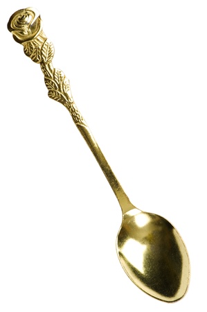 object on white - yellow spoon close upの写真素材
