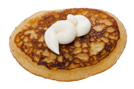 object on white - Food pancake with sour cream close up