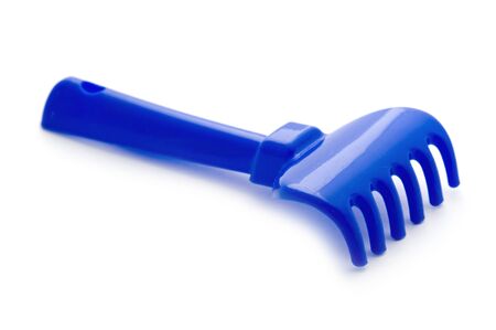 object on white - toy rake close upの写真素材
