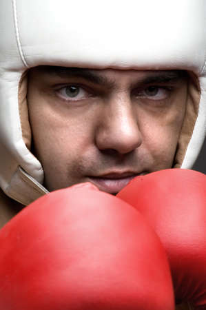 boxer in protective helmet and boxing glovesの写真素材