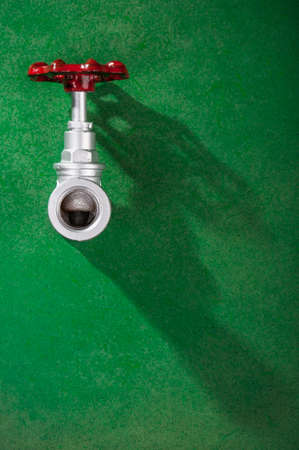 chrome brass valve - on green background