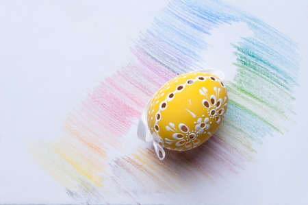 painted easter egg with cut out patternsの写真素材